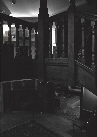 Black and white image of stairs landing in Limnerslease house