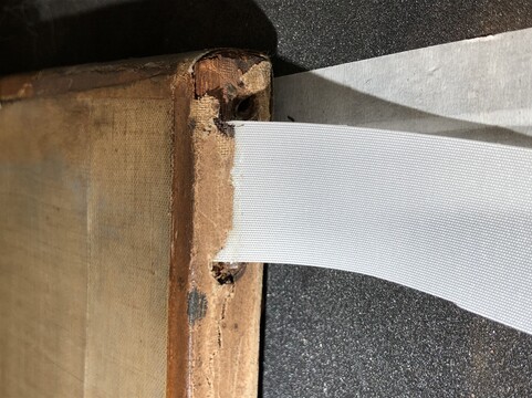 Cloth tab in between canvas