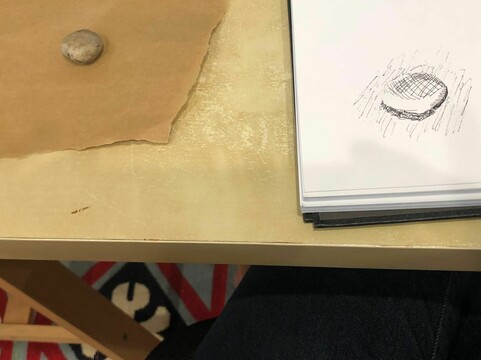 Pebble next to sketch