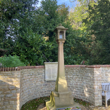 A stone war memorial sits in an alcove