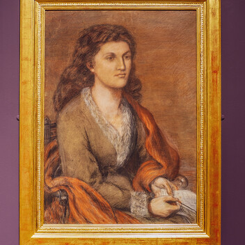 Drawn portrait of Mathilde Blind, a woman with brown hair wearing a brown dress with fur trim and an orange sash