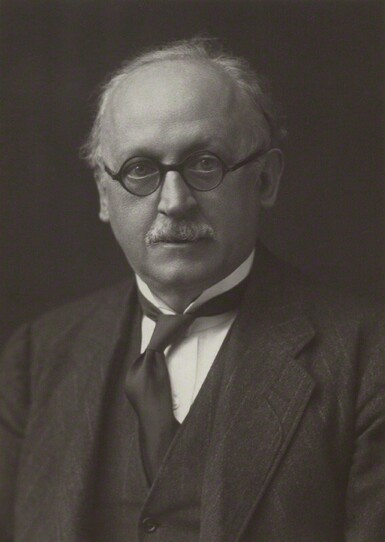 Black and white photograph of Edwin Lutyens in round glasses