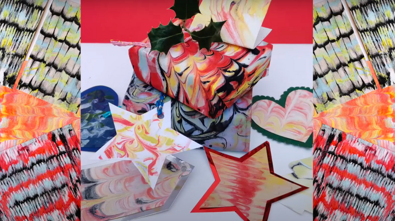 A collage of vibrant and colourful abstract art pieces, including patterns resembling butterfly wings and star shapes, arranged in a symmetrical layout.