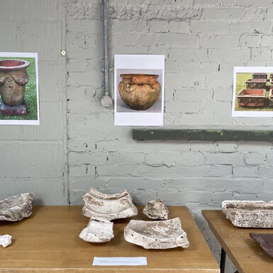 Photo of several fragments of pottery moulds for making pots