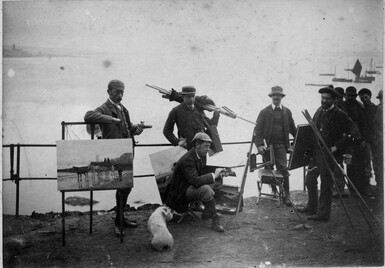 black and white photo of men in army uniforms holdings guns and easels