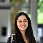 Photograph of lady with long dark hair smiling