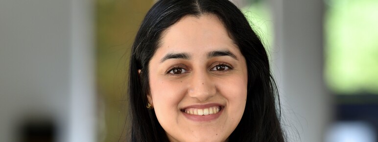 Photograph of lady with long dark hair smiling