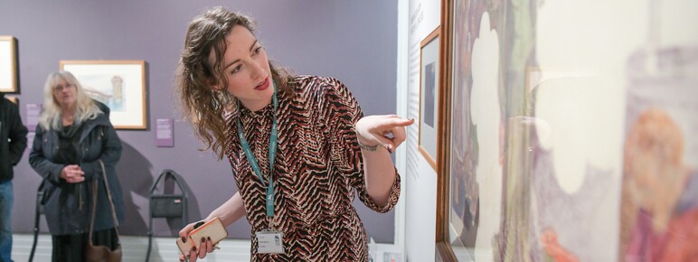 Woman pointing at a painting
