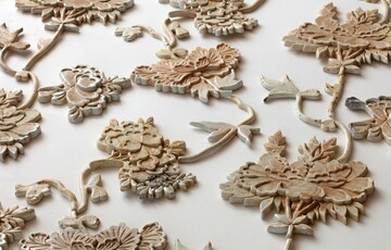 Photo of floral ceramic pieces laid on a flat surface