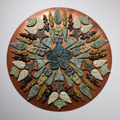 Circular ceramics artwork by Kay Aplin featuring repetitive shapes in a mandala-type pattern