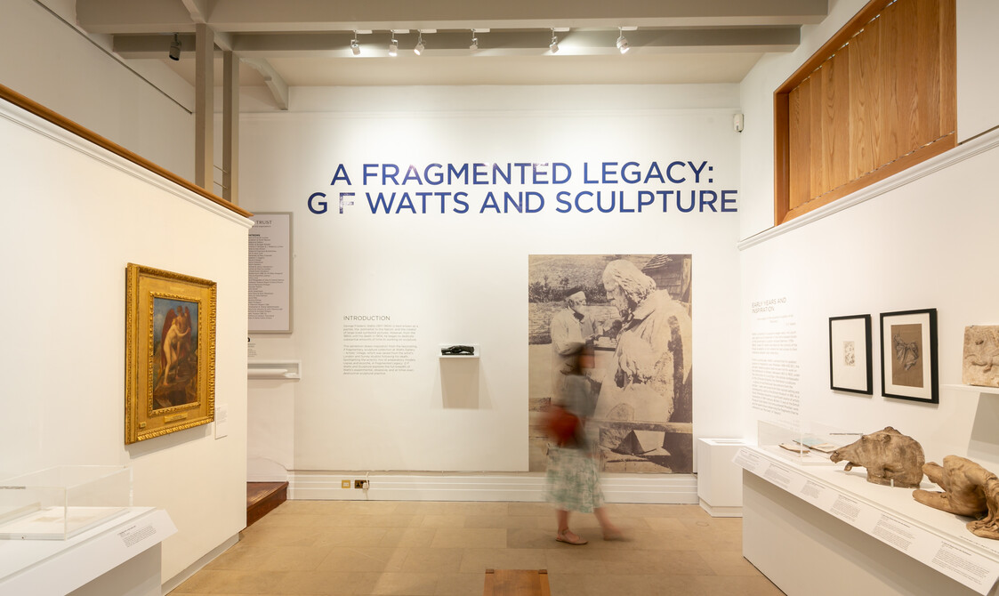 A figure walks through the A Fragmented Legacy exhibition