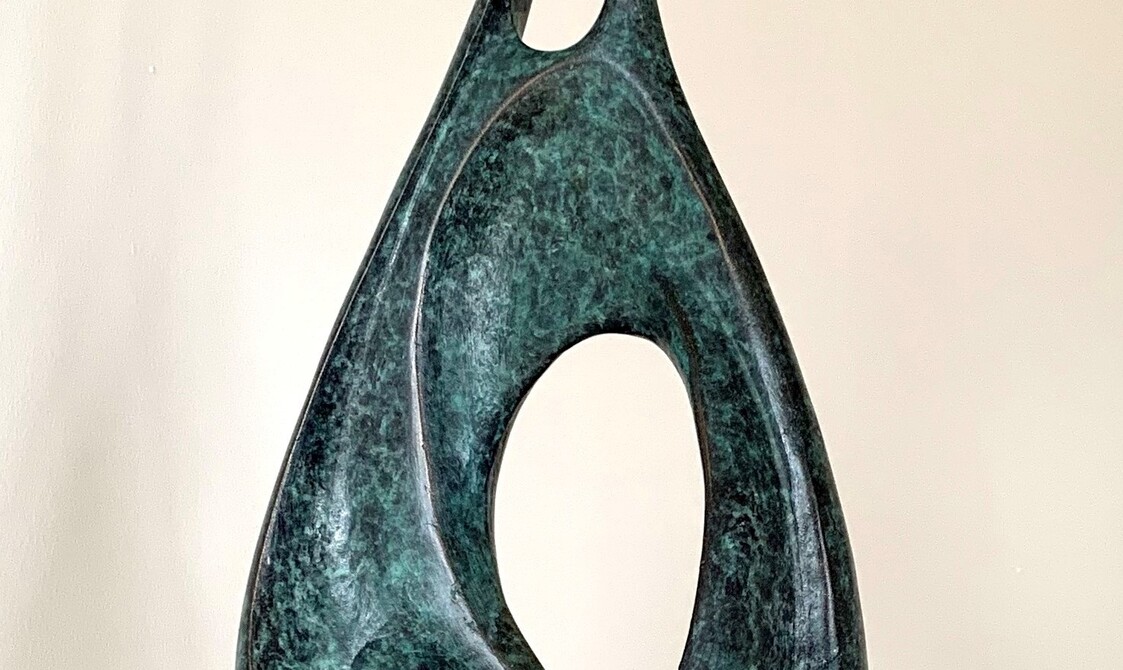 An abstract tear drop shape made of bronze