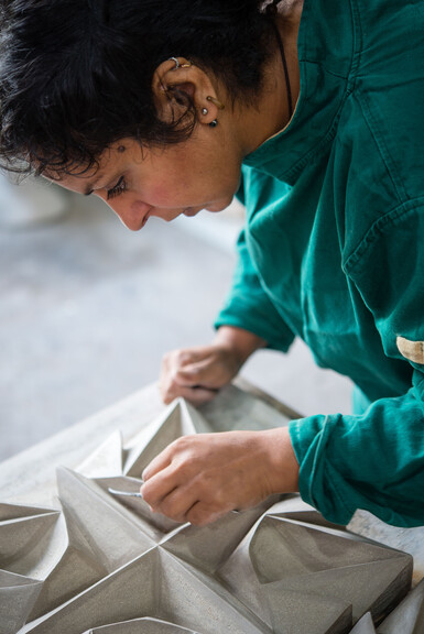 Halima Cassell working on an artwork