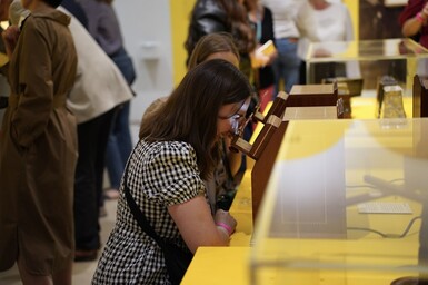 Young woman looks into a modern stereoscope to see images in 3D