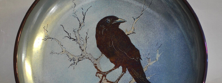 Blue lustreware plate with blackbird on a twig design