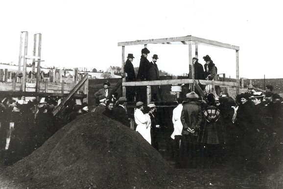 Archive photograph of G F Watts surrounded by the local community in Compton laying the foundation stone to Watts Gallery