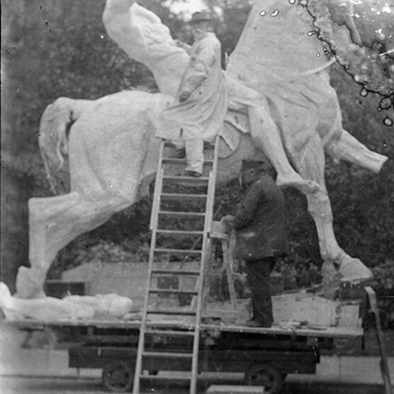 G F Watts sat on a ladder at the base of the figure riding the horse on Physical Energy. He looks towards the camera