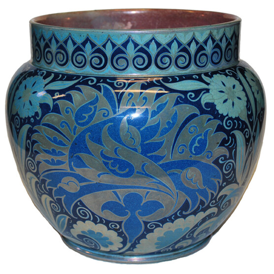 Squat jardiniere with short straight neck. Decorated in moonlight lustre colours, with floral and leaf decoration.