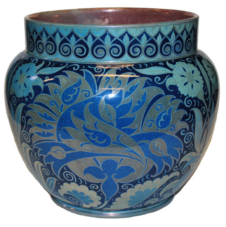 Squat jardiniere with short straight neck. Decorated in moonlight lustre colours, with floral and leaf decoration.