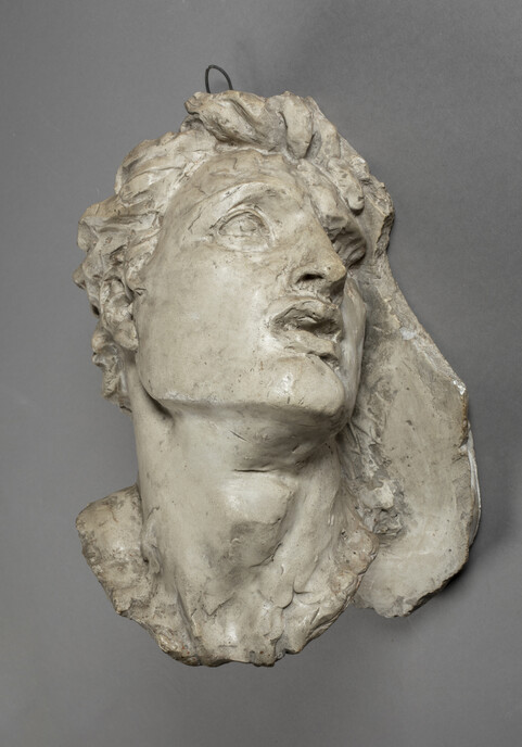 A plaster study head of a man looking distraught