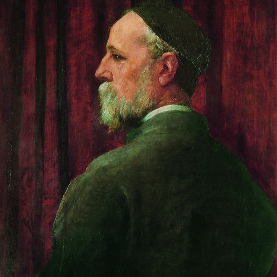 Watts is turned away from us but looks over his shoulder so we see his profile, he wears a black skull cap.