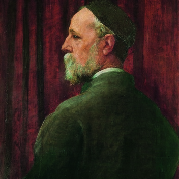 Watts is turned away from us but looks over his shoulder so we see his profile, he wears a black skull cap.