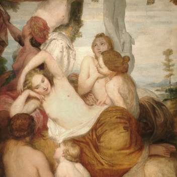 A group of woman gather underneath a leafy canopy