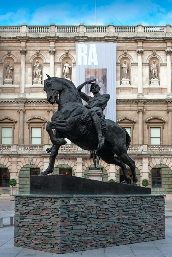 Bronze statue of a man on a horse outside the RA
