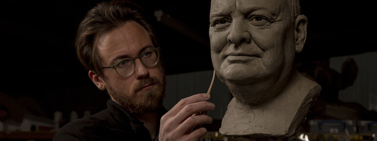 Jethro Crabb sculpting a clay head of Churchill.