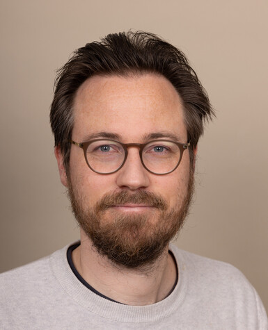 A portrait of Jethro Crabb smiling.