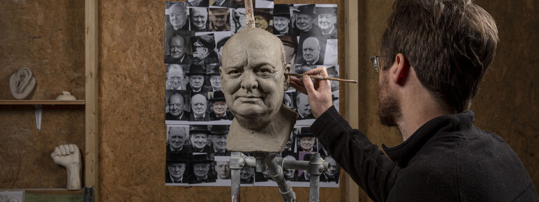 Jethro Crabb in his studio sculpting the head of Winston Churchill