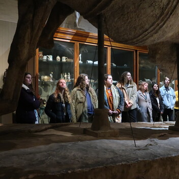 A group of young people looking at sculpture