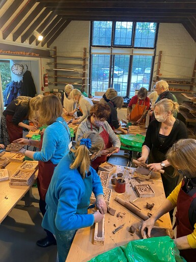 Group of participants making with clay