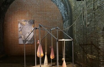 Photo of an abstract sculpture made from metal frames and pieces of cloth that are filled and tied to the sculpture