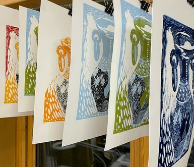 Photo of six prints hung up and drying