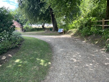 The gravel path towards the gallery is slightly uphill and turns to the left behind a grass verge