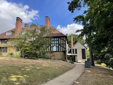 Outside building with panelled detail and path
