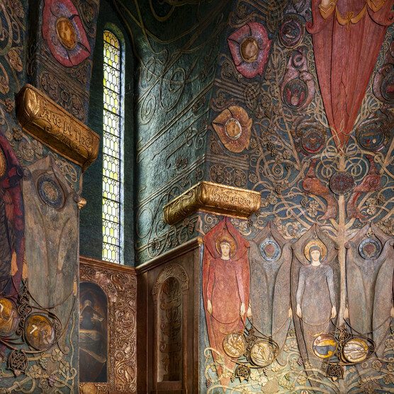 Interior of the chapel. Angels are depicted in rows and narrow windows let in some light.