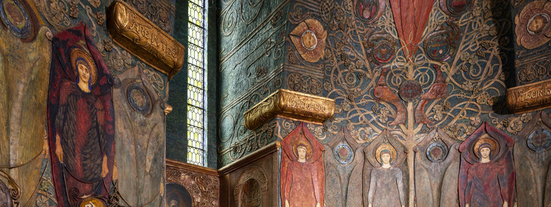 Interior of the chapel. Angels are depicted in rows and narrow windows let in some light.