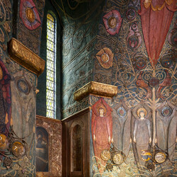 Interior of the chapel. Angels are depicted in rows and narrow windows let in some light.