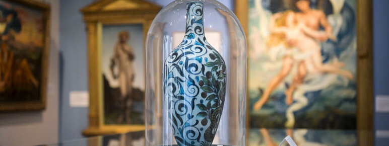 Vase in glass case in gallery