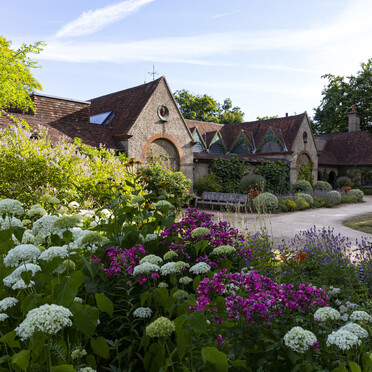 The exterior of Watts Gallery in the summer