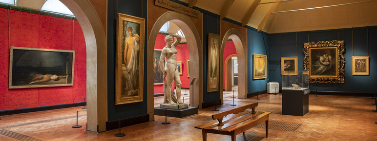 Historic gallery features oil paintings in gold frames and sculptures