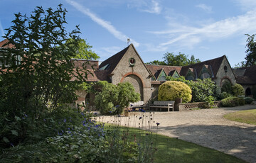The outside of the Watts Gallery building on a sunny day