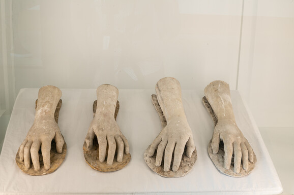 A range of sculpture casts of hands in case