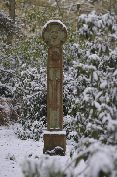 Terracotta free standing cross in snow