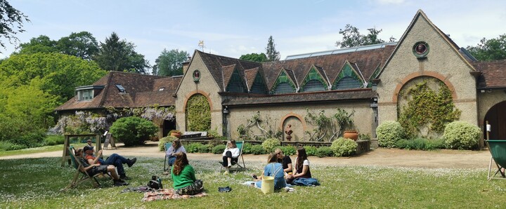 Group of people enjoying a picnic on the lawn outside the Historic Gallery