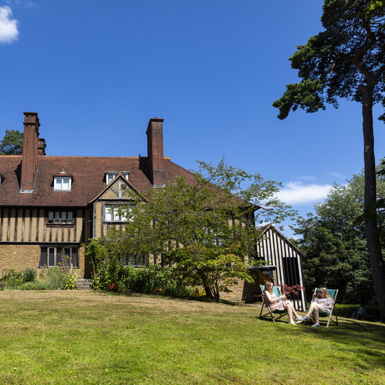 Blue sky with historic panelled house
