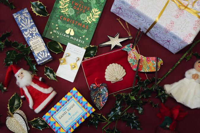 Christmas gifts including a book, purse and felt father christmas