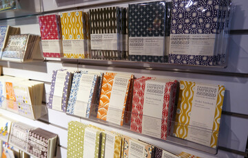Patterned notebooks on shelf